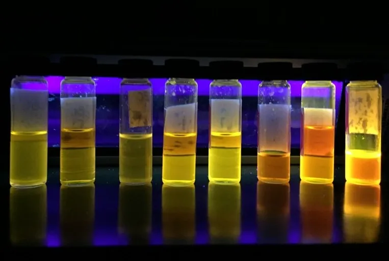 PUNC researchers using glowing test tubes without lights
